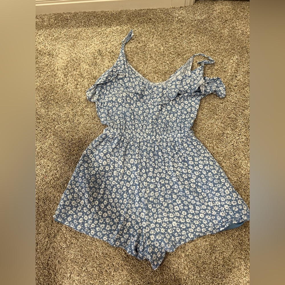 Blue floral romper with a ruffle on the top (side small)